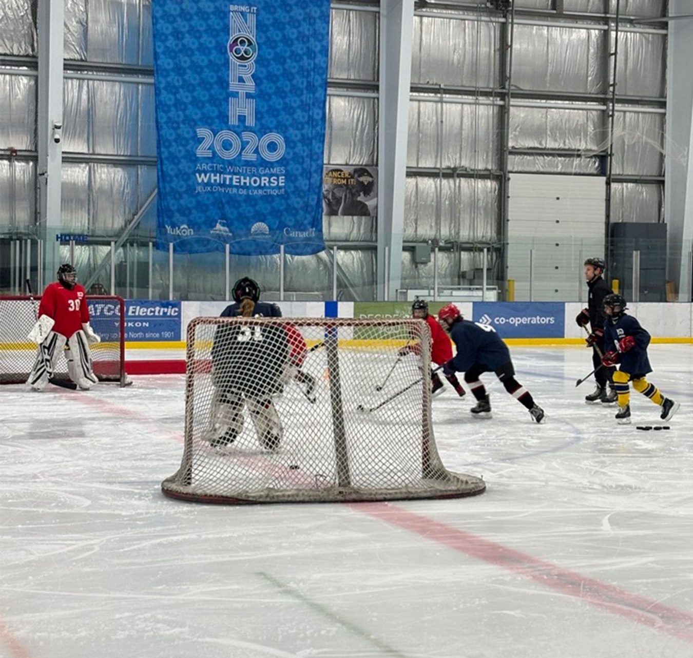 Kids playing hockey at a summer camp