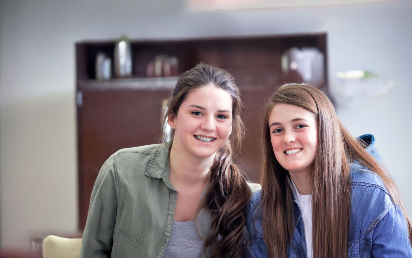 Two female Notre Dame students smiling for a Photo