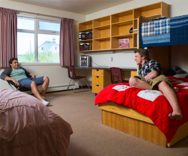 Two Notre Dame male students in dorm room