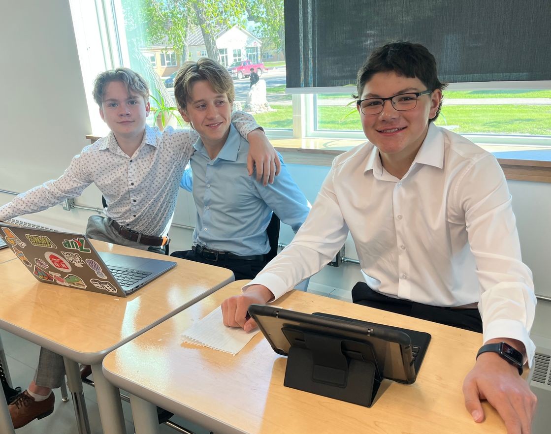 Notre dame Students in class and tables smiling